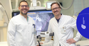 Picture of Drs. Loizides and Widmann with Micromate robot